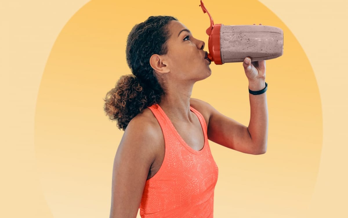 Woman drinking a pre workout drink