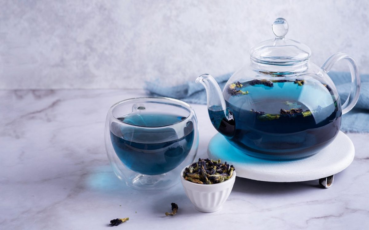 blue tea in mug and teapot
